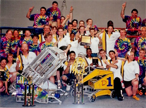 The winning alliance of team 1 and team 111 with robots and awards [1]