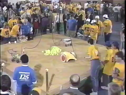 The chicken playing in team -16's position in heat 19 of the 1992 FIRST Robotics Competition [5]