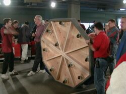 Woodie Flowers showing the bottom of the puck [13]