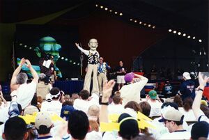 Woodie Flowers on stage with a giant statue of himself [1]