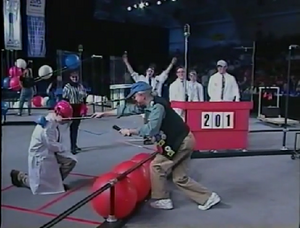 Woodie Flowers introduces team 201 before the start of match 19 of the double elimination tournament [2]