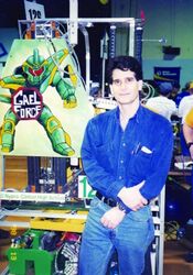 Dean Kamen in front of team 126's robot in the pits [4]
